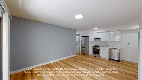 a view of a kitchen with a wood floor and white cabinets